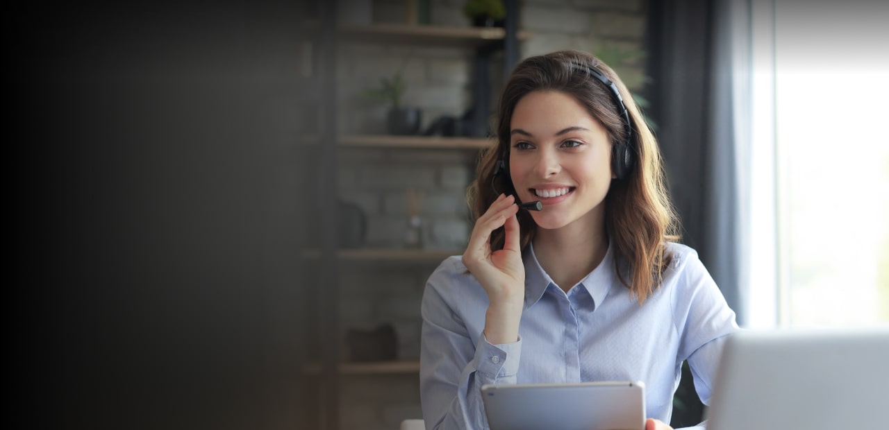 Male receptionist speaking over headphones