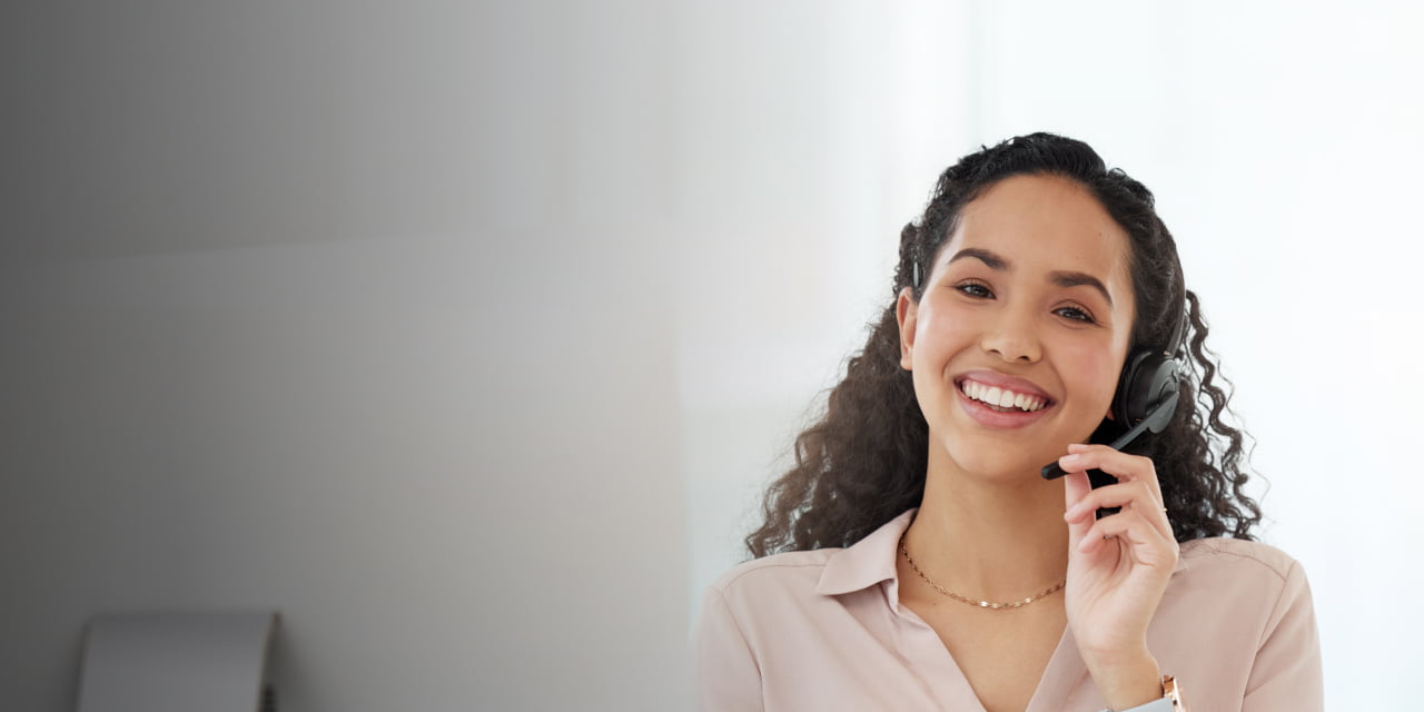 Female receptionist speaking over headset