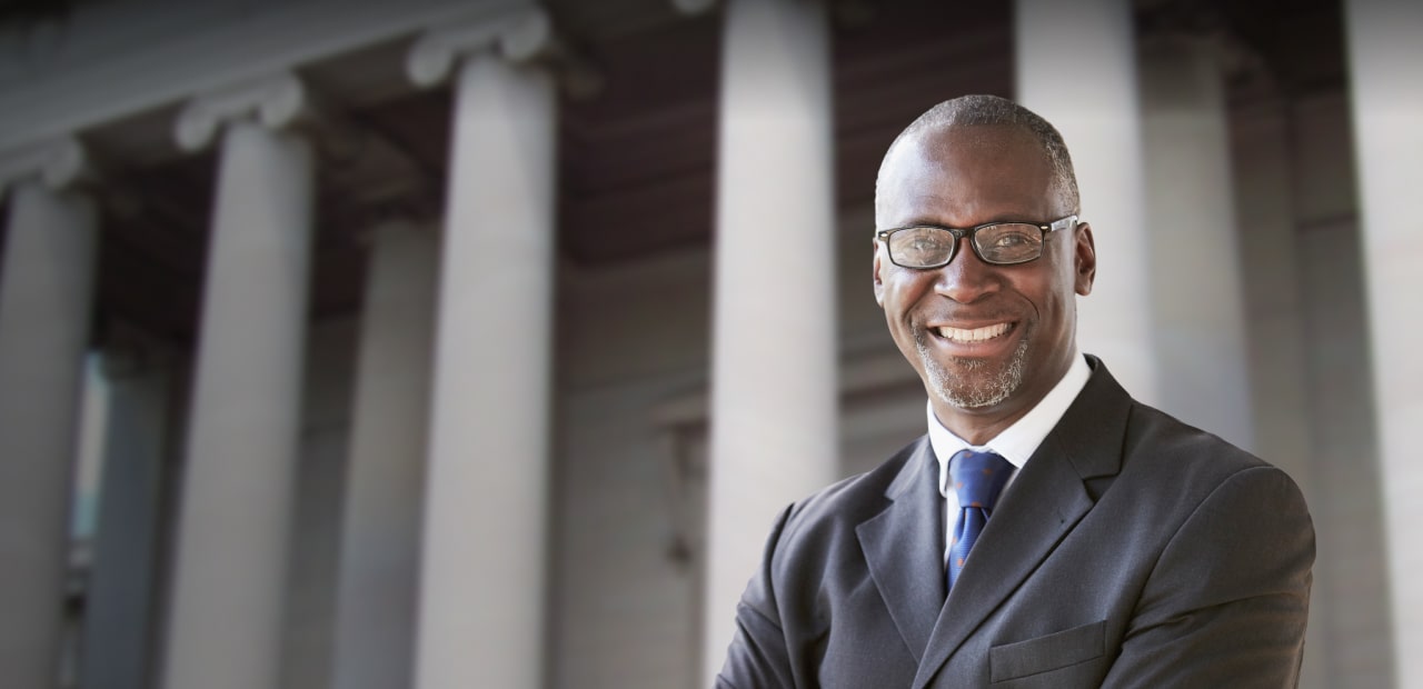 smiling lawyer wearing glasses