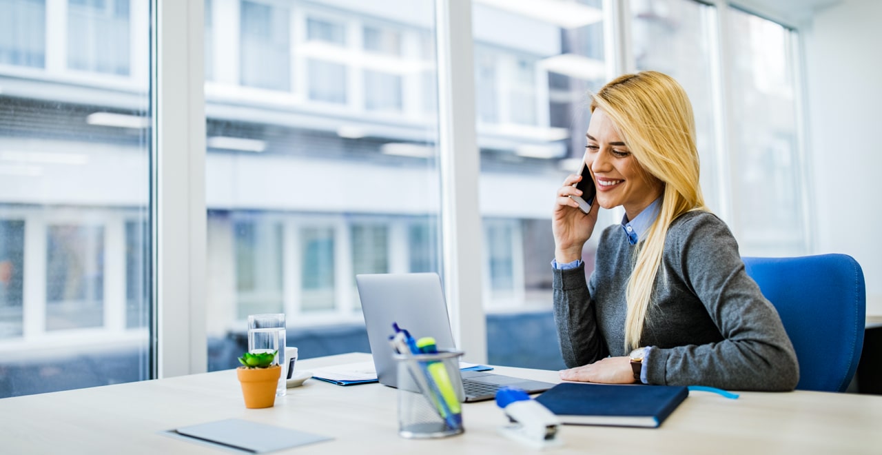 Smiling woman talking over phone