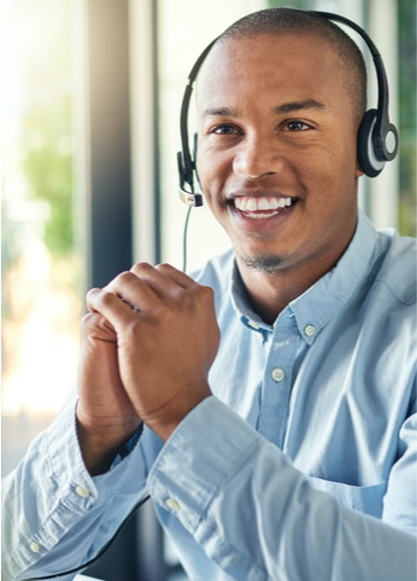 Male receptionist speaking over headphones